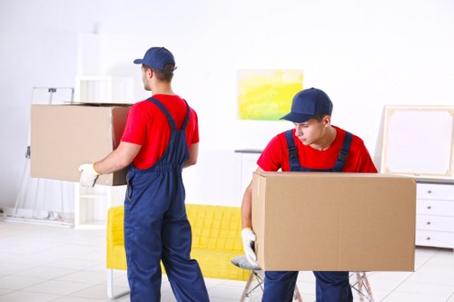 Urgent same day removals team loading boxes in Richmond