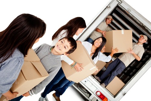 Moving boxes and furniture in Richmond during a house relocation