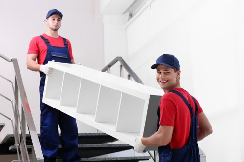 Professional team preparing an upright piano for safe removal in Richmond