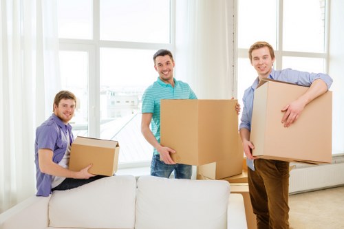 Experienced house removalists in Richmond unloading items into a new home