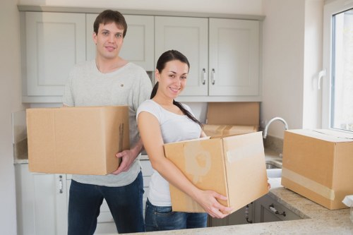 Professional movers loading furniture into a Richmond removal van